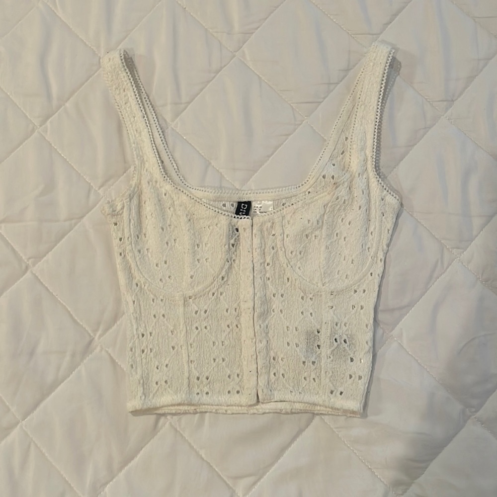 white cropped corset-like top